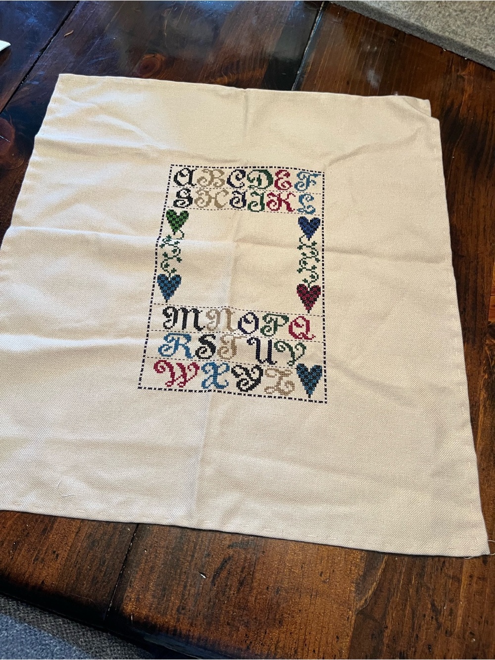 Cream Cross-Stitch Alphabet Sampler Panel with Multicolor Hearts